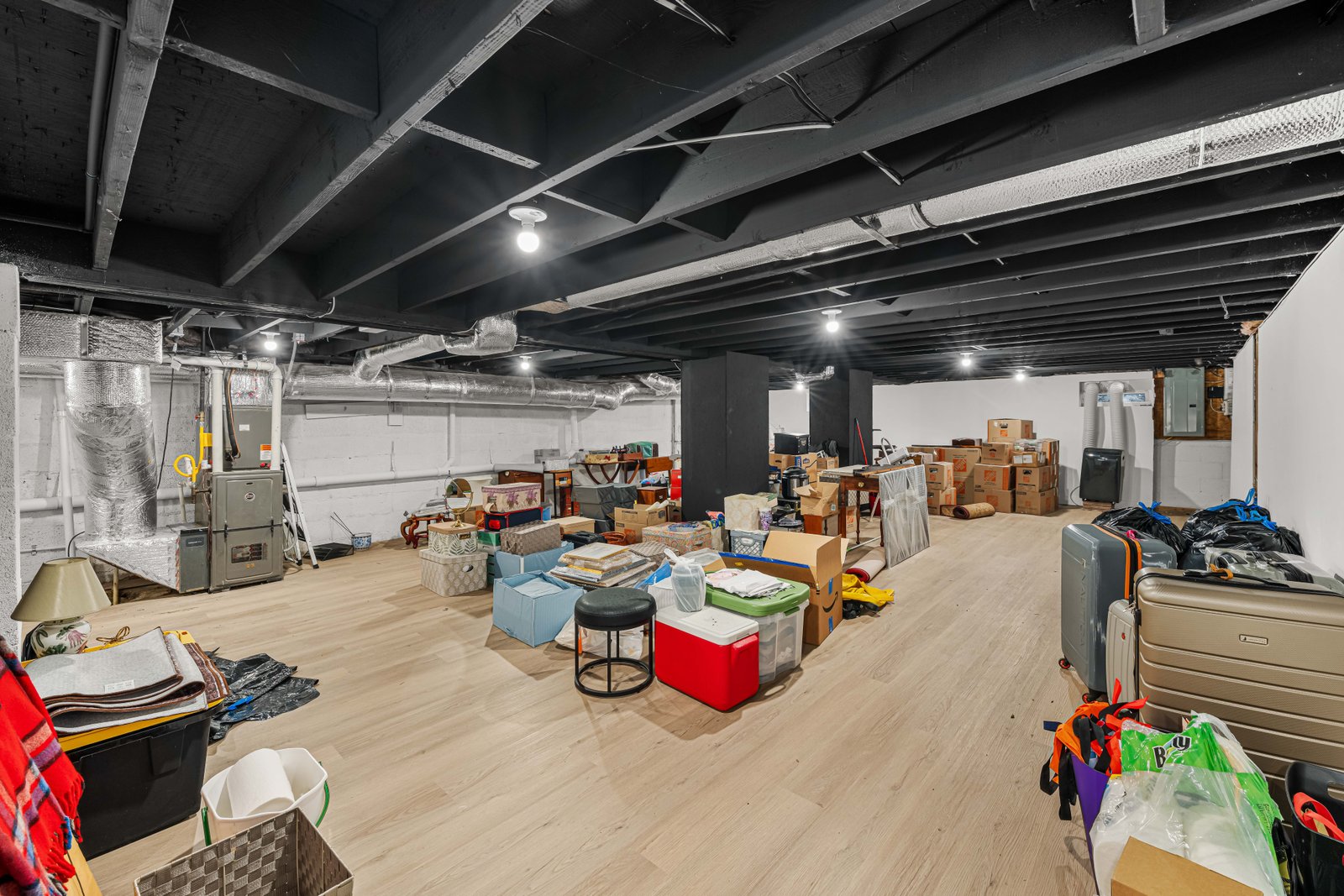 Basement with waterproof plank flooring