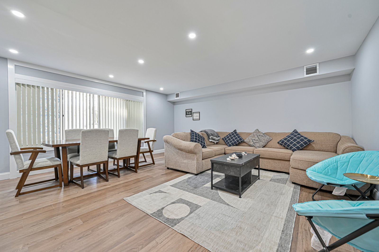 Open living and dining room with luxury vinyl plank flooring