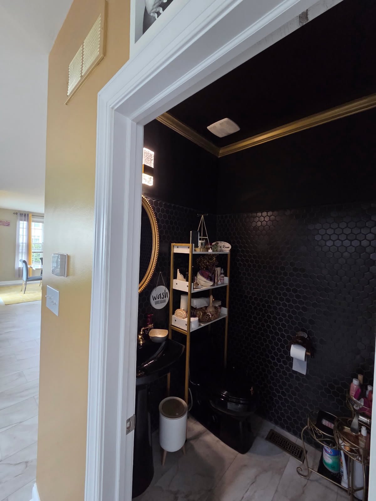 Powder room with black hex mosaic tile