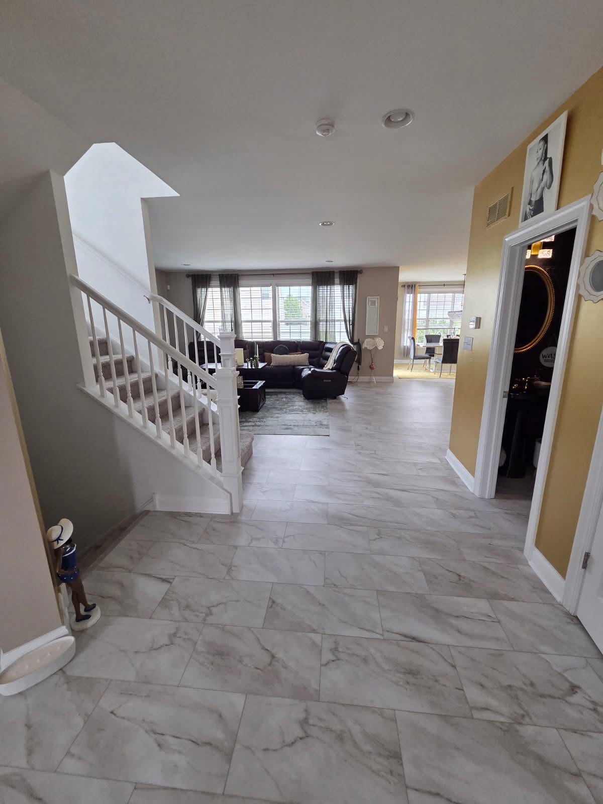 Marble-look porcelain tile entry and hall