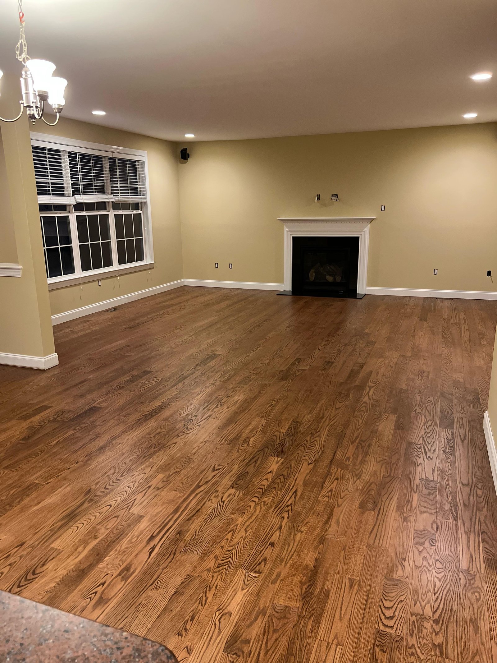Refinished red oak floor at fireplace