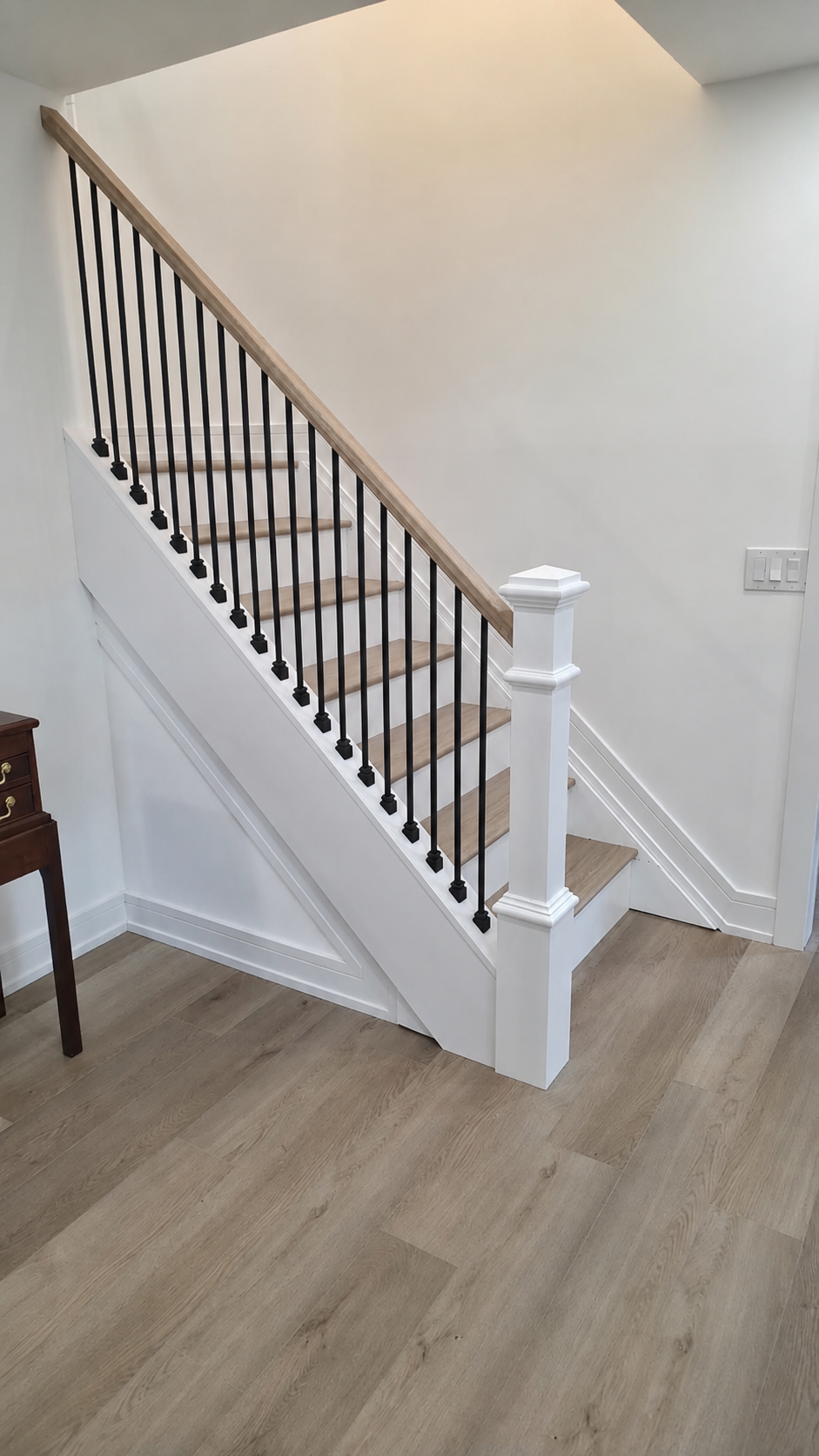 White oak stair treads with iron balusters